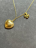 Pre-loved Tory Burch mother of pearl heart logo necklace