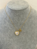 Pre-loved Tory Burch mother of pearl heart logo necklace