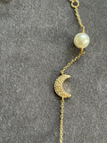 Tory Burch moon and star necklace