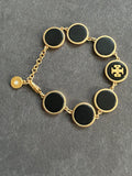 Pre-loved Tory Burch Black & Gold Logo Disc Bracelet