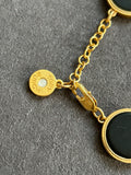 Pre-loved Tory Burch Black & Gold Logo Disc Bracelet