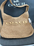 Coach Brooklyn Shoulder Bag in natural paper straw with leather trim.