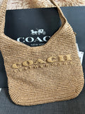 Coach Brooklyn Shoulder Bag in natural paper straw with leather trim.