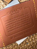Coach Brooklyn Shoulder Bag in natural paper straw with leather trim.